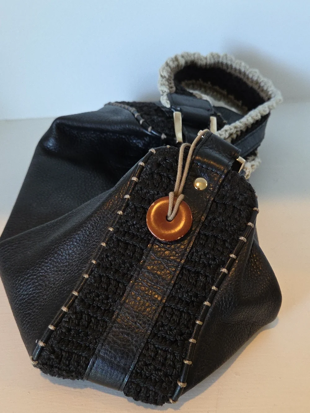 The Sak Pink Label knitted handle black leather handbag.